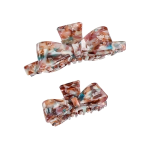 Elegant butterfly-shaped acetate hair clips with marble texture for various hair types