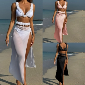 Detailed view of 3-piece bikini set with mesh skirt and handmade 3D floral accents