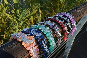 Detail of bohemian crystal headband crowns with natural stones and metal moon charms