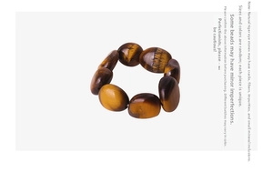 Detailed close-up of natural tiger eye stones showing unique texture and cat-eye effect