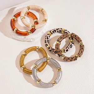 Set of 6 acrylic leopard print and amber resin bangle bracelets with gold beads
