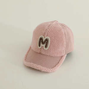 Detailed texture of pink sherpa fleece baseball cap with letter M embroidery