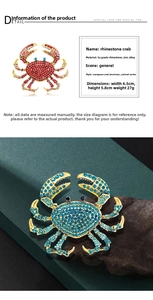 Detailed view of rhinestone crab brooches in red and blue showing 6.5x5.8cm dimensions