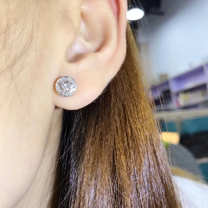 Silver-colored heart-shaped zircon hoop earrings for women with side-view model shot