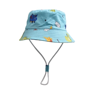 Detail of light blue sun hat with cartoon dinosaurs and adjustable chin strap for kids