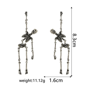 Detailed view of skeleton drop earrings showing dimensions 8.3cm by 1.6cm and weight 11.12g