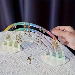 Rainbow iridescent acrylic jewelry display with cloud base showing earrings detail