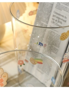 Detailed view of clear cute desktop trash can with cartoon bear and flower prints