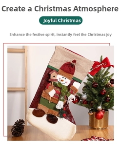 Close-up of a large Christmas stocking with a 3D snowman patch and cozy holiday fabric texture
