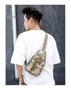 Tactical digital camouflage cross-body bag shown on model's back with adjustable strap