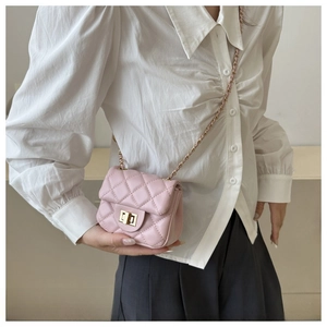 Pink quilted crossbody bag with gold chain strap and metal turn-lock closure detail