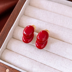 Elegant 18K gold-plated red double oval stud earrings in a white velvet jewelry box