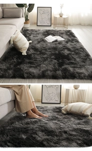 Close-up of soft dark grey shaggy plush rug texture for modern living room decor