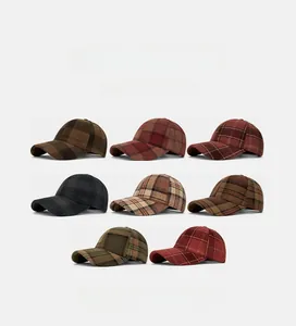 Flat lay of colorful plaid baseball caps in various vintage wool patterns for autumn