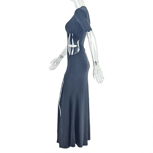 Detail view of dark grey knitted maxi dress with waist cut-out and high side slit