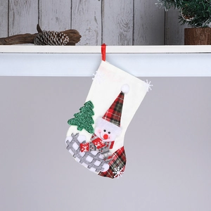 Detail of burlap Christmas stocking featuring 3D snowman, tree and red hanging loop