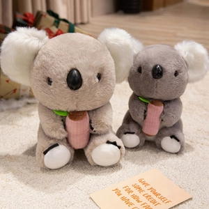 Cute plush koala toys in grey and beige colors set on a soft rug for children gift