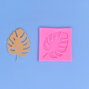 Pink monstera leaf silicone mold for DIY cake decorating and resin craft projects