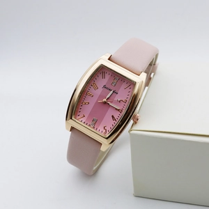 Macro view of rectangular rose gold watch with pink leather strap and diamond dial