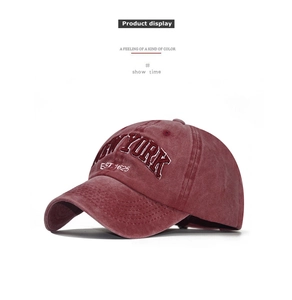 Detailed close-up of 3D NEW YORK embroidery on vintage washed cotton baseball cap