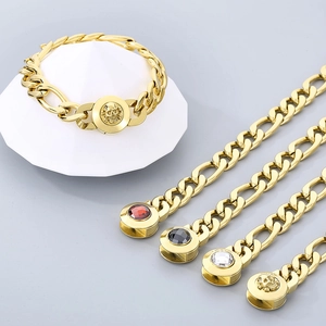 Men's titanium steel gold-tone chain bracelets with skull and gemstone charms on display