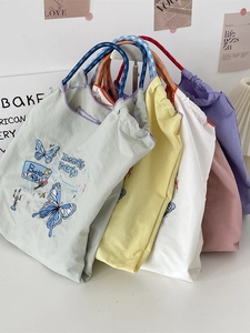 Sweet butterfly embroidered oxford tote bags in pastel colors with woven handles