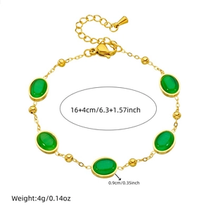 Gold stainless steel bracelet with oval green gemstones and lobster clasp closure