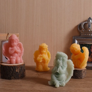 Cupid angel wing prayer silicone candle mold with four colorful artistic wax figures