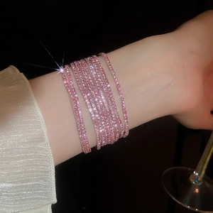 Close-up of pink crystal multi-layer stretch bracelet with sparkling rhinestones on wrist