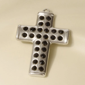 Detailed view of 304 stainless steel cross pendant inlaid with black rhinestones