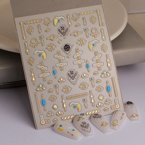 Golden 5D nail art stickers with celestial star moon designs and geometric patterns
