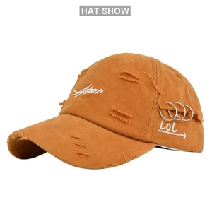 Distressed baseball cap in ginger with Asher embroidery and side metal ring detail