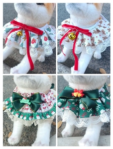Detail view of plaid pet Christmas bandanas with lace trim and festive patterns