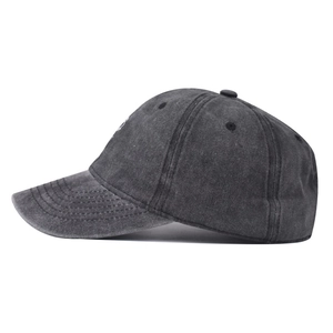 Side view of washed charcoal grey cotton baseball cap with distressed canvas texture