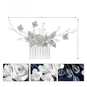 Detail of white polymer clay flowers and crystals on a bridal wedding hair comb