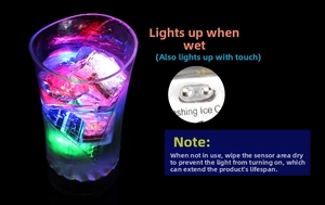 Detail of multi-color LED ice cubes lighting up in water with sensor mechanism view