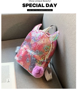 Detail of the colorful sequined unicorn backpack featuring a soft purple pom-pom