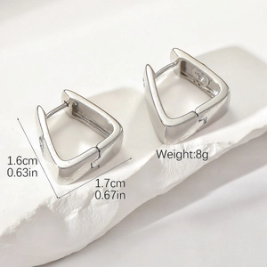 Detailed view of silver geometric square earrings with micro-set zircon evil eye
