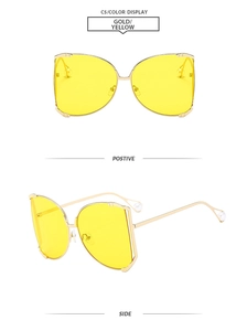 Detail view of square gold metal sunglasses with yellow lenses and pearl temple tips