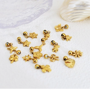 Group of golden stainless steel DIY charms including butterfly, heart and flower shapes