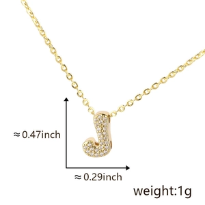 Detail view of gold letter J pendant with cubic zirconia, size 0.47 x 0.29 inch and weight 1g