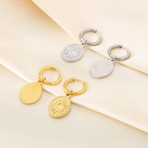 18K plated stainless steel oval drop earrings with celestial sun and moon relief