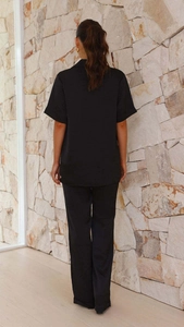 Detail view of the black short sleeve lapel pajama set with loose-fitting long trousers