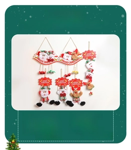 Detailed view of Santa, snowman, and elk hanging decorations with small golden bells