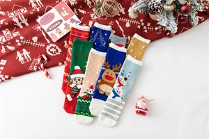 Close-up of festive Christmas coral fleece socks in multiple colors with holiday patterns