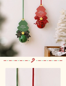 Detail of Christmas tree hanging ornaments with red and green bells and Merry Christmas cards