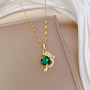 Elegant gold dolphin necklace with green heart crystal and white zircon stones