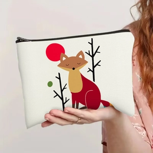 Minimalist canvas fox print makeup bag with black zipper held in a hand