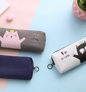 Flat lay of colorful Japanese style canvas pencil cases with cute cat illustrations