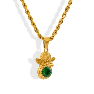 Macro shot of gold angel pendant with green gemstone on a twisted rope chain